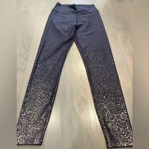 Purple and gold splattered peloton leggings